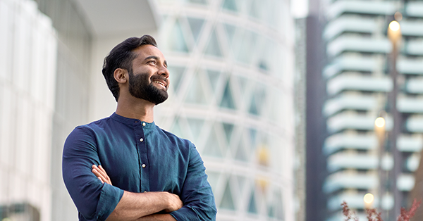 A man smiles out over the city, having finalised his Directors Loan Agreement from Parachute Law